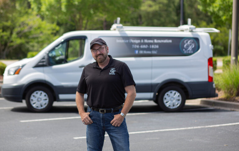 Eric with his company's van in the background.