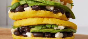 Stacked fresh with avocado, cilantro, black beans, and cheese