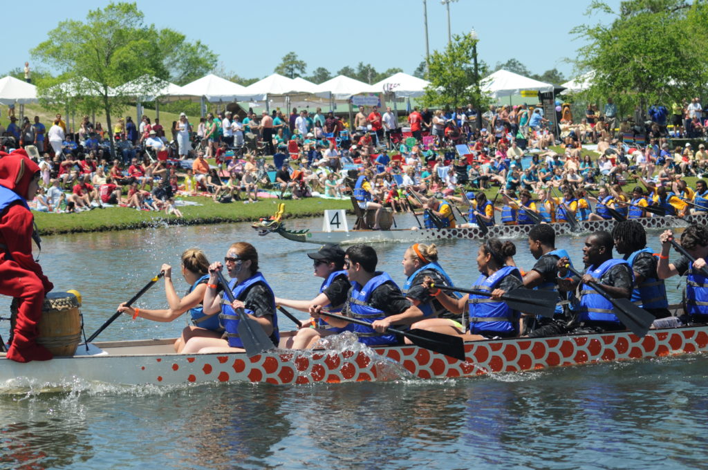 The vibrant boats take to the water in the Market Common during the annual Dragon Boat Festival.