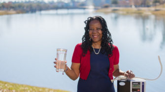 Alsuna Roland, the Grand Strand's Kangen Water respresentative, is being photograpphed at the Market Common.
