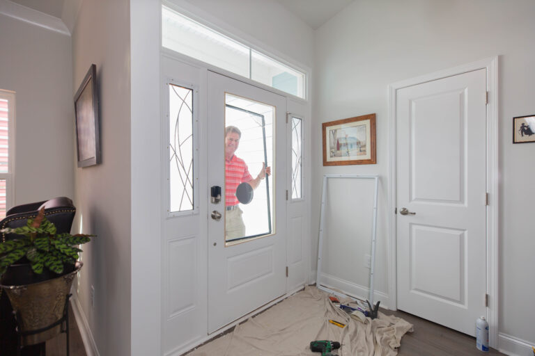 Ken installs a glass panel in a front door, which enhances the amount of natural daylight entering. At an entry price point of $699, the transformation is very affordable.