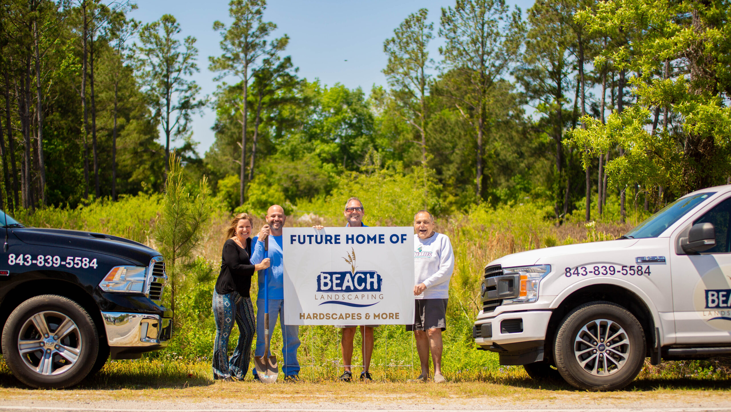 The Freedman family owners stand, excitedly, at the site of where their new Beach Landscaping office will be in Myrtle Beach. From left to right: Tracy, Matt, Andy and Bob.