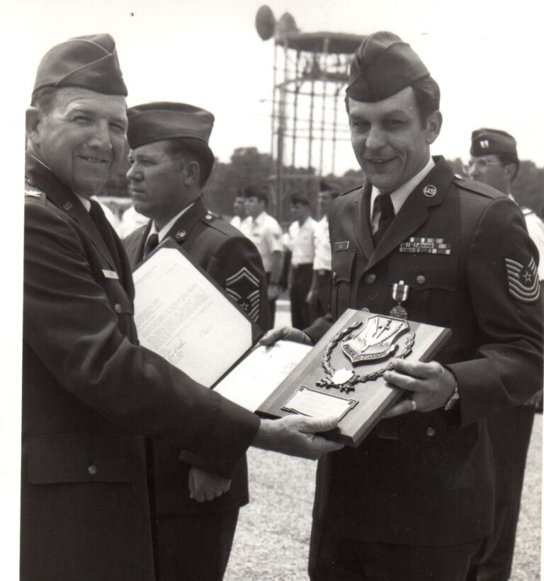 Larry Dodd (right) in Iceland, receives The Instructor of the Year award in 1983.