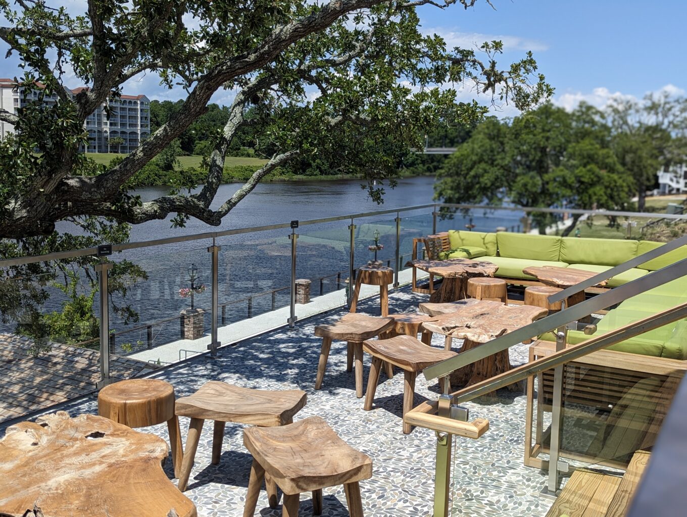 Exterior patio at Big Chill Island House in Barefoot Landing, North Myrtle Beach. It overlooks the waterway; has an oak tree with lights