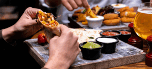 From Buckets of Oysters to $2 Brews, These Local Favorites Pour It Right