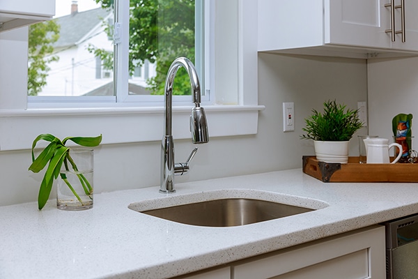 Beautiful modern kitchen interior with sink, cabinets, stainless steel in New Luxury Home